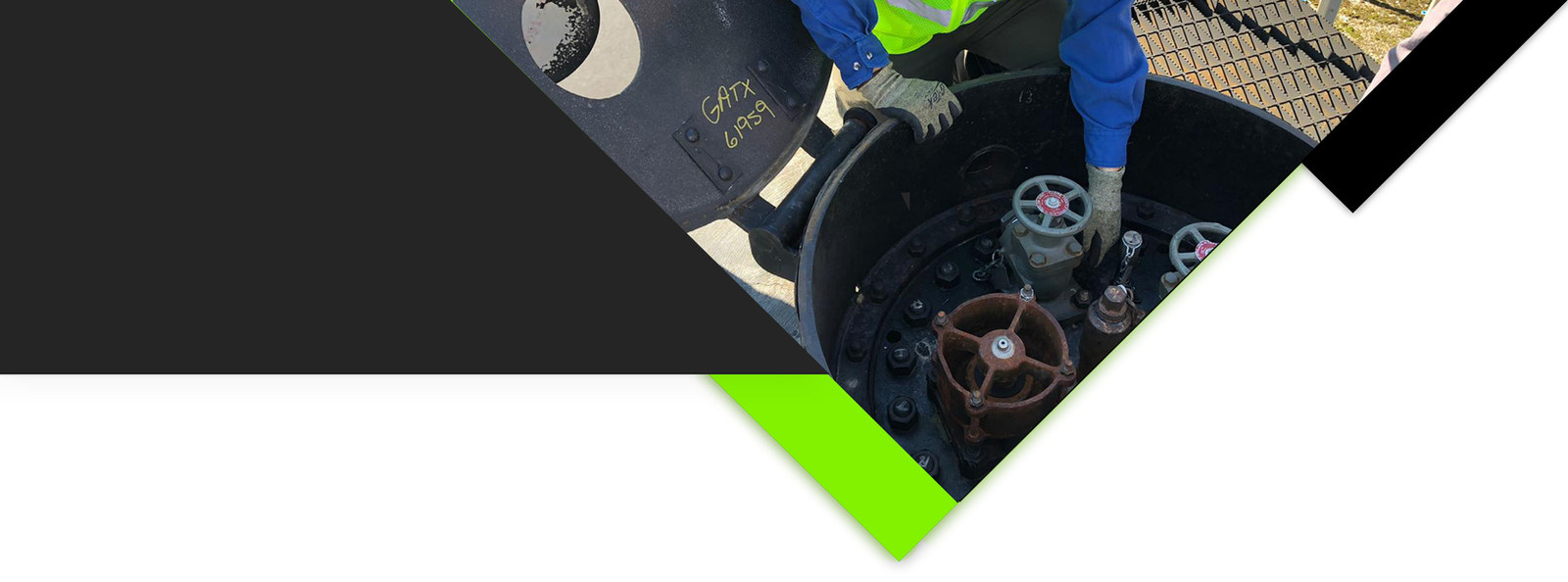 Specialist inspecting service equipment on a rail tank car